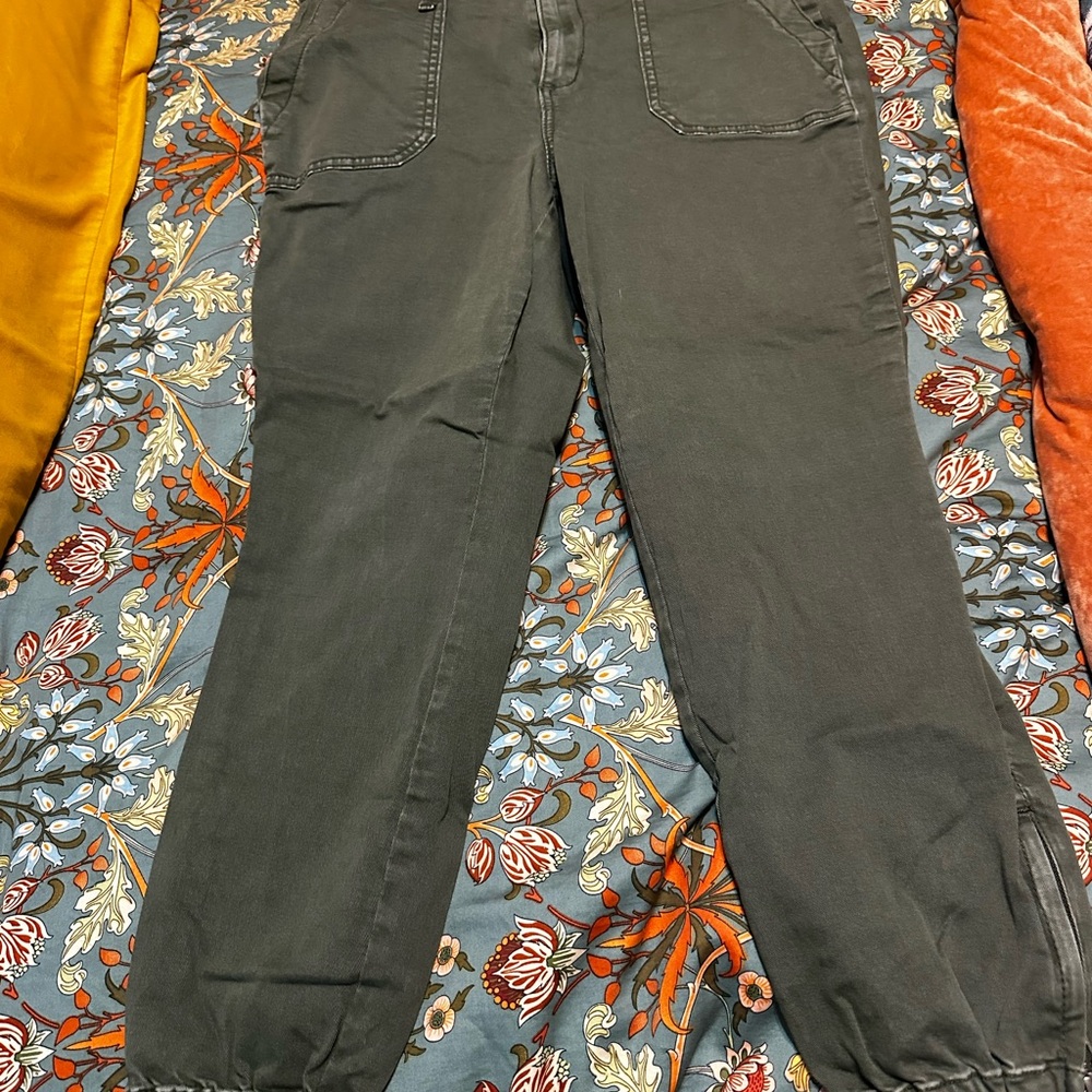 Torrid Olive Green straight leg pants with zipper detail at the ankle